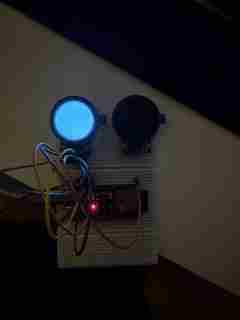 Early electronics prototype with one illuminated circular screen and the other dark